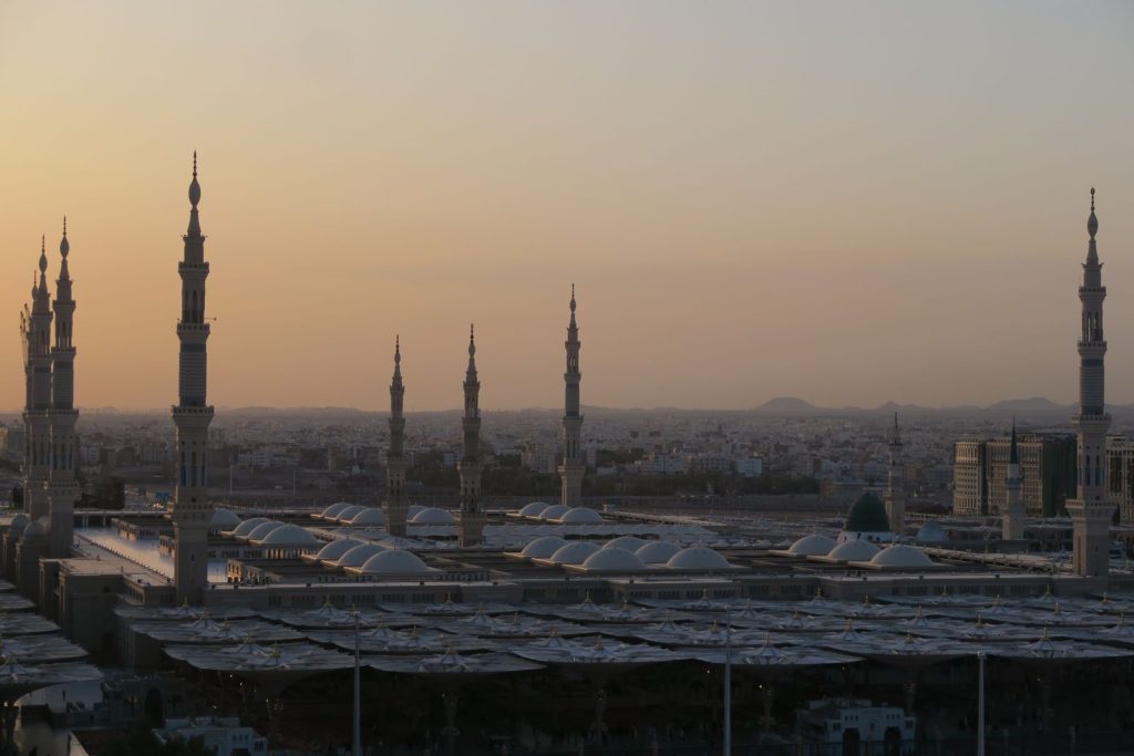 A stunning sunset view of the Prophet's Mosque in Medina, Saudi Arabia.